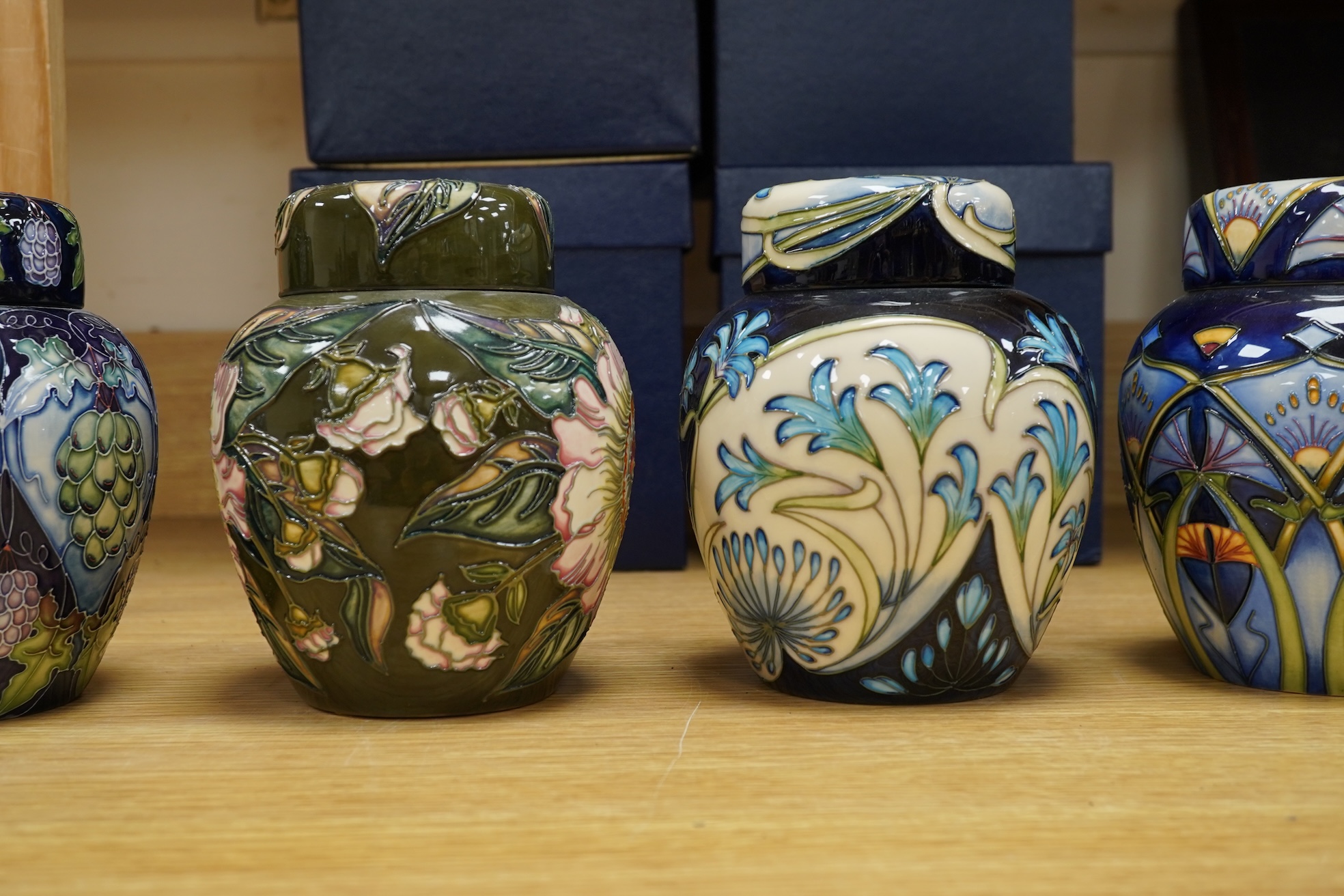 Four Moorcroft ginger jars and covers - ‘Midnight Blue’, ‘Inula’, ‘Sonans’ and ‘Gustav Augusta’ (4) 17cm high